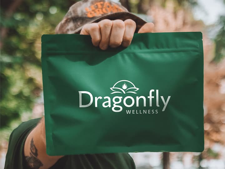 Person holding a delivery from Dragonfly Wellness